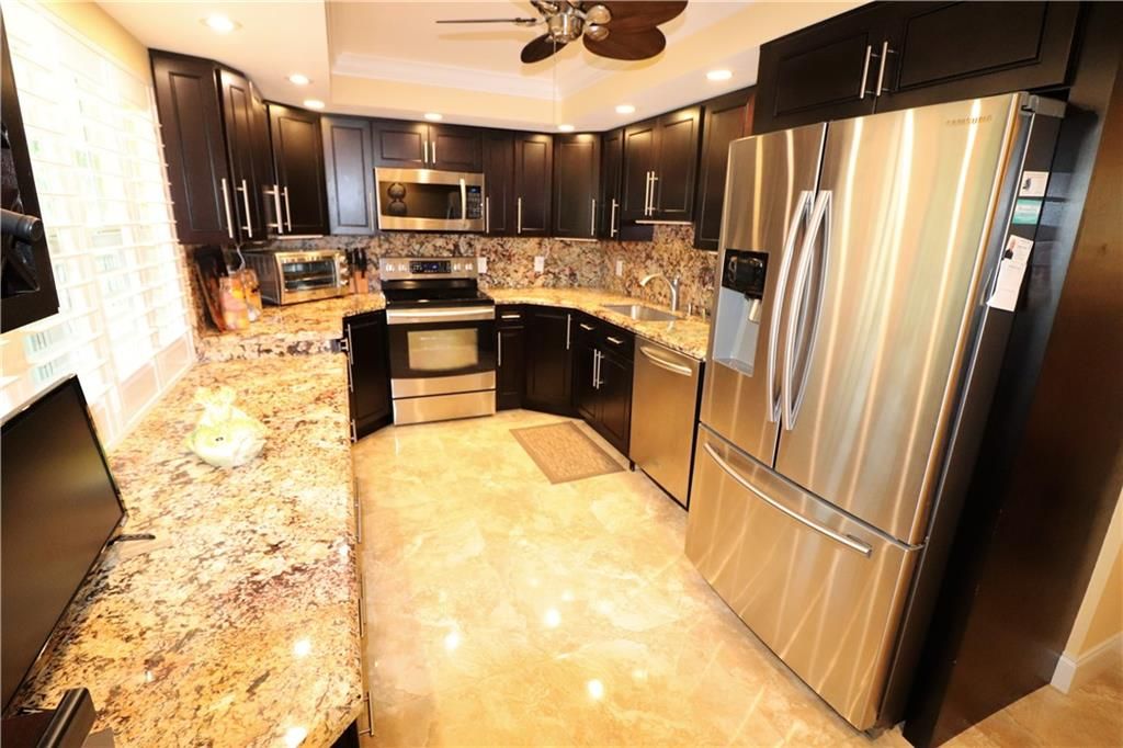 Photo of 3505 Oaks Way #303, Pompano Beach, FL 33069 (MLS # F10258998)