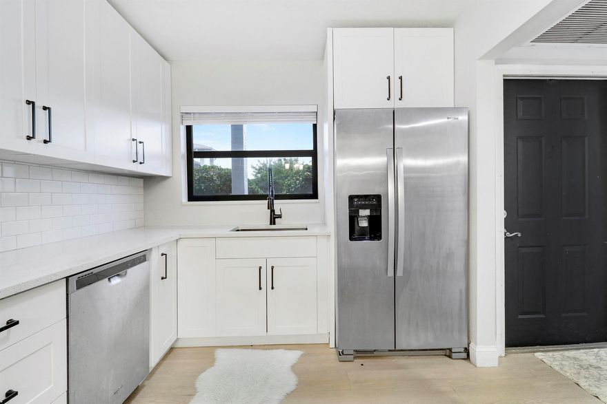 Two master's with on-suite baths! Full 3 bedroom, 3 bathroom remodeled condo.  This 1st floor spacious condo that backs up to a beautiful wooded area with extra large newly screened patio. Completely gutted & remodeled in 2022 with newer appliances, washer & dryer, water heater, vinyl plank floor, quartz counter tops, knockdown ceiling texture, partial impact windows, new plumbing, new electrical(all receptacles, switches, fixtures) throughout, newly painted interior & exterior, resurfaced parking lot, newer roof, move in ready. Owner is a licensed real estate broker.