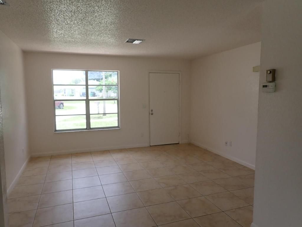 Photo of 499 NE Elmore Street, Port Saint Lucie, FL 34983 (MLS # R10996950)