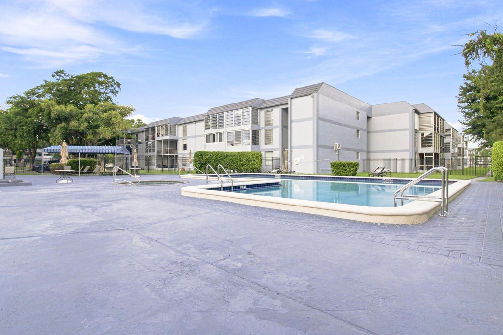 Photo of 8321 Sands Point Boulevard #D305, Tamarac, FL 33321 (MLS # B26071661)