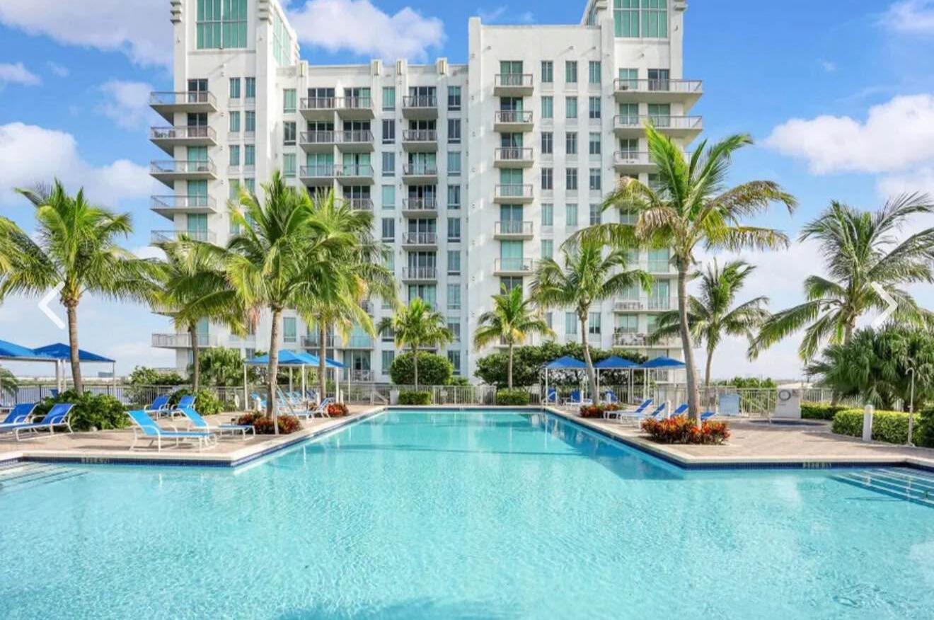 Urban loft style Downtown WPB unit overlooking vast West facing Clear Lake views with gorgeous sunsets from all windows. Largest 1-1 in the building. Features 10' ceilings, king size bedroom, double closets incl. a walk-in, full sixe in-unit laundry, double sink vanity, eat at island/bar area, 1 garage spot, WiFi, sewer, water, trash incl. Featuring beautiful clubhouse with updated gym, work spaces, TV/gaming areas, fire place, roof-top Olympic size swimming pool, hot tub, BBQ Grills and cabanas. Also offered is 24 hour staged front desk, on-site mail, Amazon package hub, bicycle storage, EV charging and dog park! Walk or Free Ride and Circuit to Downtown Clematis Street, City Place and Palm Beeach, close to PBI Airport, trains, outlets, shopping, dining and parkways.