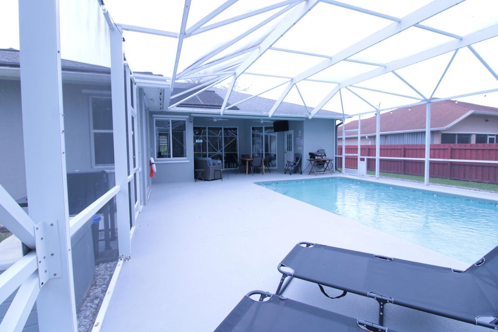 Photo of 2957 SW Collings Drive, Port Saint Lucie, FL 34953 (MLS # B26006834)