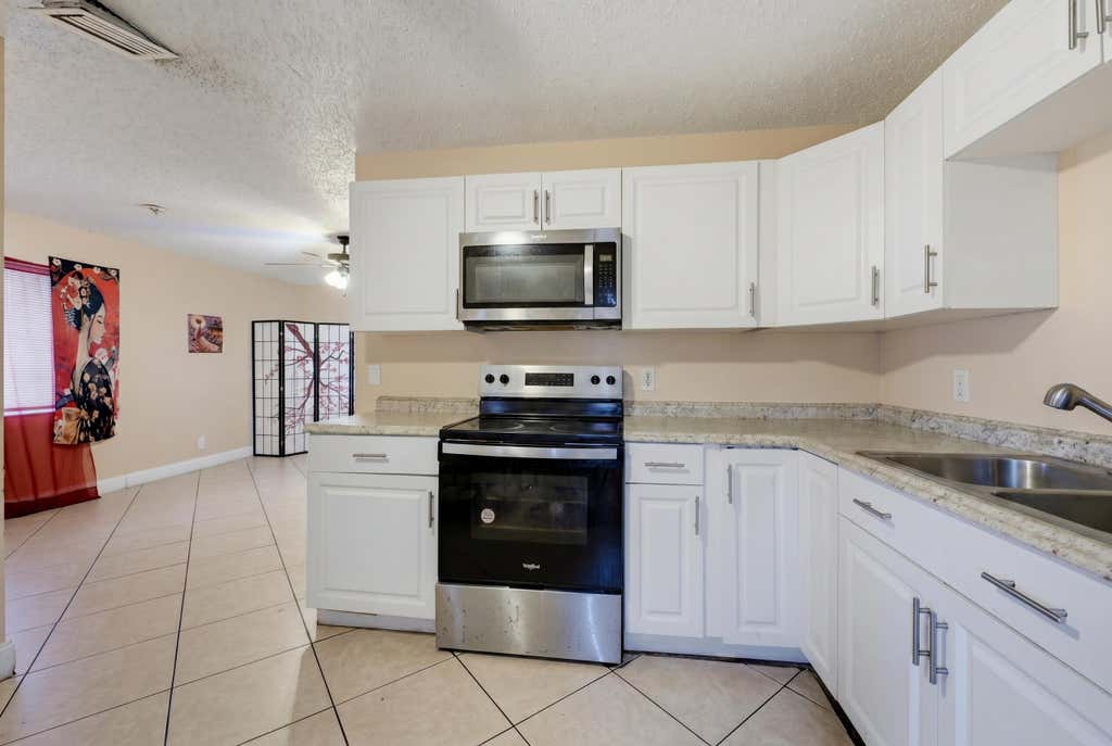 Photo of 1525 W 17th Street, Riviera Beach, FL 33404 (MLS # B26045901)