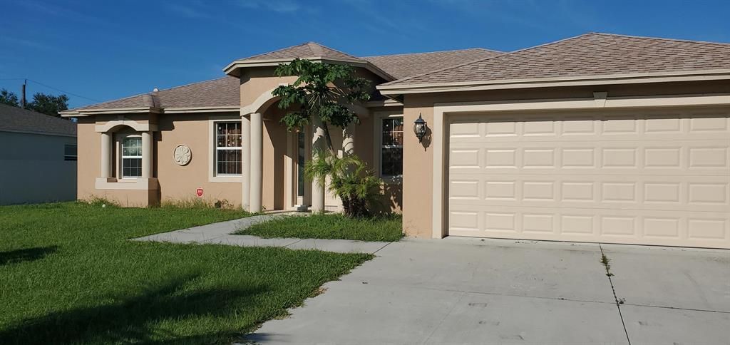 Photo of 3982 SW Kamsler Street St SW, Port St Lucie, FL 34953 (MLS # R10745775)