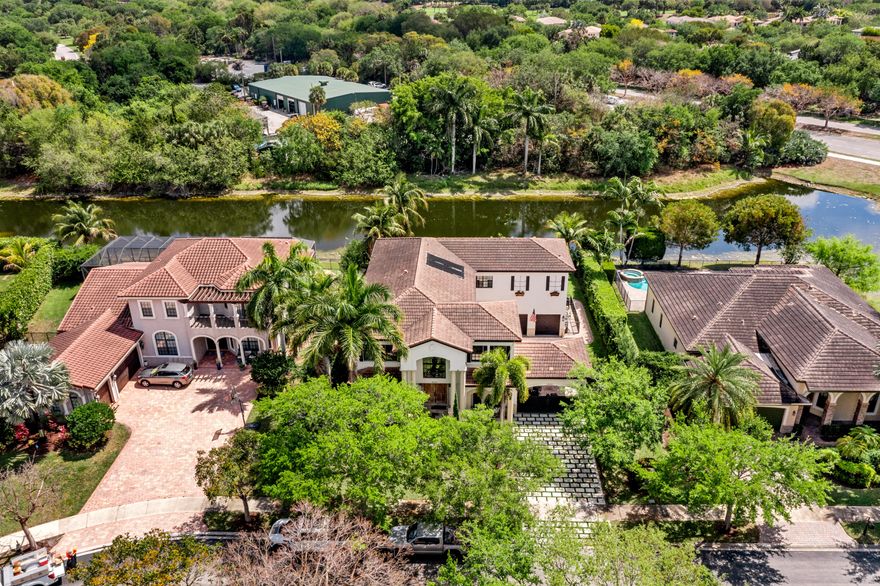 Luxury & Turnkey Andalusian Model 5 Bed + Loft & 4.5 Bath Pool Home Situated On A Waterfront Lot w/Porte-Cochère. $200k In Recent Updates. Completely Renovated Kitchen w/Quartz Counters, Breakfast Bar, Gas Cooking, Stainless Steel Appliances, Ample Cabinetry & Separate Wine Cellar. Primary Suite Features Sitting Area, Walk-In Closets w/Built-Ins, Dual Vanities & Sinks & Separate Tub & Shower. Recently Painted Interior & Exterior, Reconstructed Driveway & Added Gate, High Ceilings, Built-In Fireplace & Bookcase & Cabinetry. All Beds Upstairs & Full Cabana Bath Downstairs. Backyard Oasis w/Covered Lanai, Pool & Spa w/All New Pool Equipment & Lounge Area Overlooking Gorgeous Water Views Ideal For Entertaining. Close To Parkland Parks, A-Rated Schools, Major Shopping, & Restaurants.