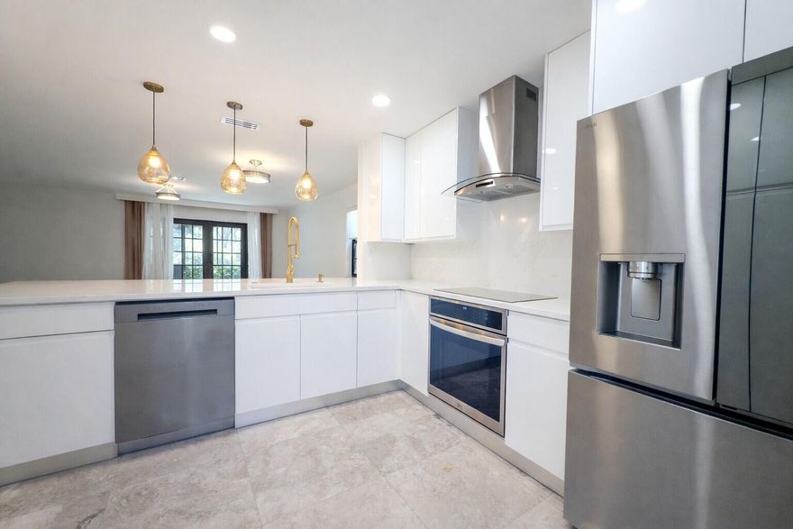 Live the ultimate Plantation lifestyle in this fully reimagined corner-unit townhome! This stunning rental features a designer kitchen with quartz counters, sleek cabinetry, and new stainless smart appliances. Enjoy marble floors, impact windows and doors, and a bright open layout filled with natural light. Smart-home upgrades include smart switches, entry system, and high-tech toilets for modern comfort. Updated bathrooms, new flooring, and fresh paint make it feel like new construction. Corner location and landscaping offer extra privacy. Easy access to Plantation Walk, grocery, dining, coffee, gyms, major highways and more!