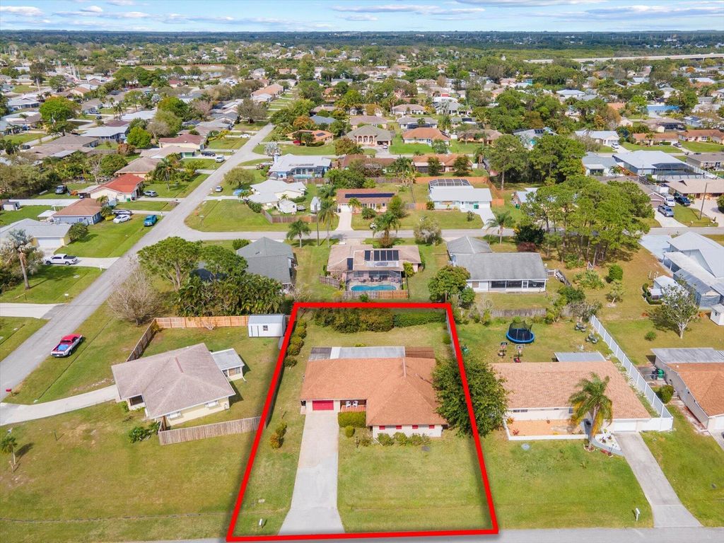 Photo of 911 SE Walters Terrace, Port Saint Lucie, FL 34983 (MLS # R10961612)