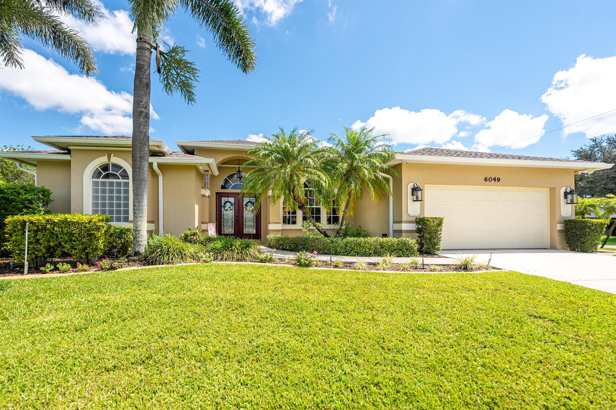 This Gem Home is located on a beautiful corner lot. Split plan with tile and waterproof laminate flooring in the bedrooms. Kitchen has plenty of cabinets for storage, and open to a generous size family room. Plenty of room to entertain on the back patio and pool area. Roof and gutters redone in 2021, New screening done a few months ago, new hot water heater done 2024, and air conditioner 2018. Please verify all information, room sizes, front exposure, all info.