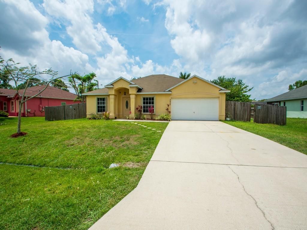 Photo of 5920 NW Conus Street, Port Saint Lucie, FL 34986 (MLS # R10711254)