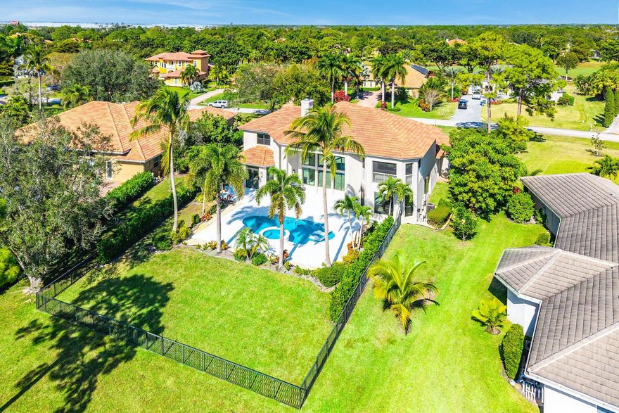 Welcome home to Sw Lands End Place. This exceptional estate style residence has been completely remodeled and is truly move-in ready, perfect for your next forever home. Offering 5 bedrooms, 5 full bathrooms, plus a dedicated office and upstairs den ideal for a mother-in-law suite or optional 6th bedroom. This home delivers space, flexibility & sophistication. The oversized driveway leads you to the grand entry and two separate 2 car garages (totaling 4 car parking), all featuring new epoxy flooring with interior access. Thoughtful upgrades abound, including impact windows & doors, new flooring throughout, a fully remodeled chef's kitchen with top of the line Thermador SS appliances, all bathrooms beautifully renovated, new whole home generator, new ac systems ,and more Outdoors, enjoy a spacious covered lanai with serene lake views, brand new salt water resort-style pool & spa and a newly fenced in yard perfect for the children, pets or entertaining. This is a rare opportunity to own a turnkey estate home in the sought after Cobblestone community of Palm City. Cape Club Membership available (not mandatory) Don't miss it.