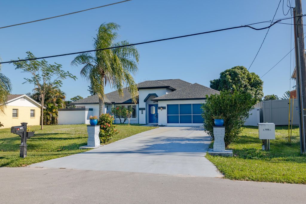 Photo of 2349 SE Pinero Road, Port Saint Lucie, FL 34952 (MLS # R11046914)