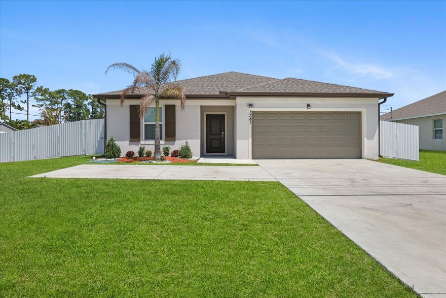 Built in 2023, this move-in ready 3BR/2BA home offers the benefits of newer construction with low maintenance and like-new systems. No HOA. Situated on a corner lot with a 2-car garage and oversized driveway. Features a private suite with dual mini-split A/C systems and soundproofing—ideal as a 4th bedroom, home office, or in-law space. Includes UV light A/C system for improved air quality. Upgrades include fully fenced yard, EV charger, remodeled laundry room, custom primary closet, tinted windows, and freshly painted interior. Newer roof, A/C, and appliances. Conveniently located minutes from Tradition, I-95, Turnpike, and St. Lucie West shopping and dining. Listing agent is related to owners. All measurements are estimates buyers/agents to verify.