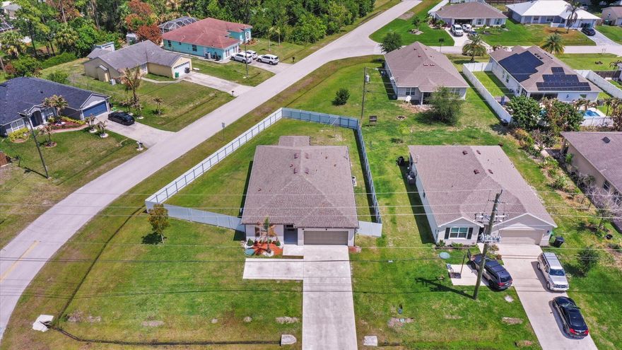 Built in 2023, this move-in ready 3BR/2BA home offers the benefits of newer construction with low maintenance and like-new systems. No HOA. Situated on a corner lot with a 2-car garage and oversized driveway. Features a private suite with dual mini-split A/C systems and soundproofing—ideal as a 4th bedroom, home office, or in-law space. Includes UV light A/C system for improved air quality. Upgrades include fully fenced yard, EV charger, remodeled laundry room, custom primary closet, tinted windows, and freshly painted interior. Newer roof, A/C, and appliances. Conveniently located minutes from Tradition, I-95, Turnpike, and St. Lucie West shopping and dining. All measurements are estimates buyers/agents to verify.