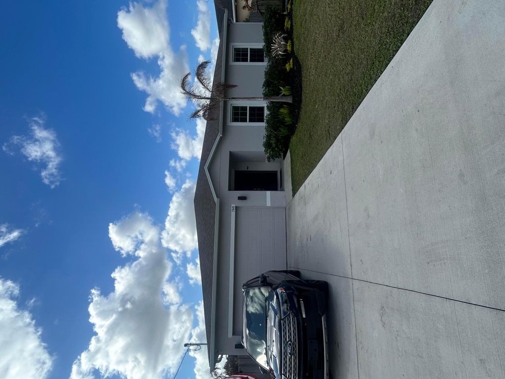 Photo of 5840 NW Bates Ave, Port Saint Lucie, FL 34986 (MLS # B26000110)