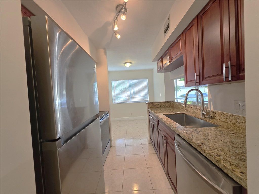 Photo of 5686 NW Rock Island Road #102, Tamarac, FL 33319 (MLS # F10534317)