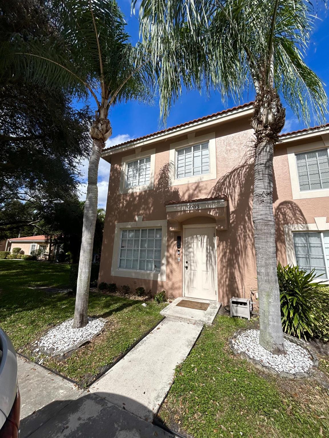 This beautiful corner unit townhome in the heart of Boynton Beach is a must see! Property features a bedroom on the first floor, stainless steel appliances, bar, and screened patio with sliding door. All flooring is new (installed in the last 3 years), along with kitchen countertops and master bathroom sink. Stairs and railings renovated as well. Master bedroom and an additional bedroom with hall bath upstairs. Roof replaced in 2019. Gated community. Two assigned parking spaces upfront.