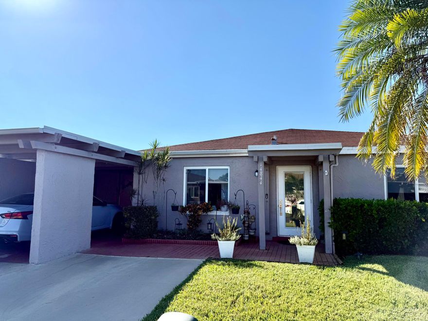 *****BRAND NEW ROOF COMPLETED 2/2026***** This COZY 2-bedroom, 2-bath Villa is in the desirable 55+ Camelot Village Community. This charming home features a completely remodeled Open Kitchen with Quartz countertops and including all New Appliances and  a Washer and Dryer for added convenience. Enjoy peace of mind with NEW IMPACT WINDOWS and DOORS throughout. Water Heater and AC both replaced in 2022. The private Screened Patio with a Privacy Fence is perfect for relaxing or entertaining. Includes a covered carport and a storage room. Residents enjoy fantastic amenities such as a Clubhouse, Community Pool, Fitness Center, Tennis Courts, Pickle Ball, Billiards, Card Room and More. Experience comfort, style, and an active lifestyle all in one place.