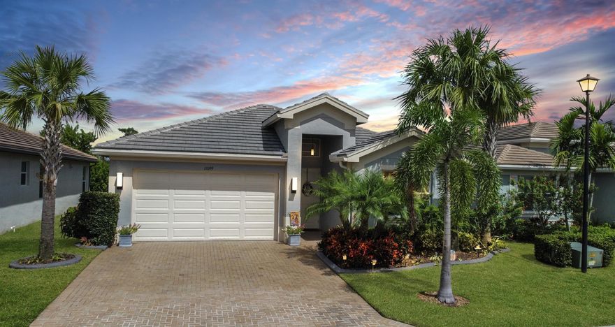 This exquisite ''Ibis'' home in the ultimate 55+ lifestyle community Valencia Cay with 2 bedrooms, 2 bathrooms plus a den has all the charm with tons of upgrades! Interior features include tile flooring throughout (NO Carpet), crown molding throughout, & custom shelves in closets. The upgraded kitchen has shaker cabinets with quartz countertops, under and above cabinet lighting, roll out drawers in lower cabinets & pull out shelves in pantry. Other features include central vacuum, electric hookup for a portable generator, storm smart hurricane shutter back lanai, extended patio w/ screen enclosure and extended paver pathway on each side with beautiful landscaping, a gardener's dream. Driveway widened, garage has porcelain tile flooring, shelves for storage and pull down attic stairs Valencia Cay residents have access to the state of the art facilities throughout the 4,000 acres of master-planned amenities at Riverland. The 51,000 square-foot Wellness & Fitness Center features a 24-hour fitness center with studios for classes, along with spa, indoor lap pool & recreational area, 2 outdoor swimming pool with lap lanes and resistance pool.  Outside at the 16-acre Sports & Racquet Club, stay active at any of the 40 outdoor sports courts for Pickleball, Tennis & Bocce Ball. Express yourself at the 5-acre Arts & Culture Center with cooking shows, painting & ceramics. Coming soon to Riverland is a 12-acre Paseo Park and Town Center all less than a mile away with access from the beautifully landscaped Paseo and greenways throughout the masterplan.