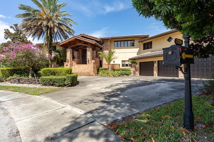 THIS IS A MUST-SEE PROPERTY! Double lakefront cul de sac lot with over 9,000 square feet under air. This custom colorado-style home offers the magic you've been searching for. Featuring 6 bedrooms + a home theatre, 10 baths and multi-split floorplan. Perfectly situated amongst shopping, restaurants, schools, and major transportation including i95 and The Turnpike. Entertain friends and family flawlessly in your large chef's kitchen with Wolfe appliances, Miele coffee system, dumbwaiter and double butler pantries. Seemingly endless wraparound terraces overlooking the lake. Woodfield Hunt club has 24 hr security with roving patrols, 5 lighted tennis courts,basketball court and a childrens playground. Optional equity membership available to Woodfield Country Club.