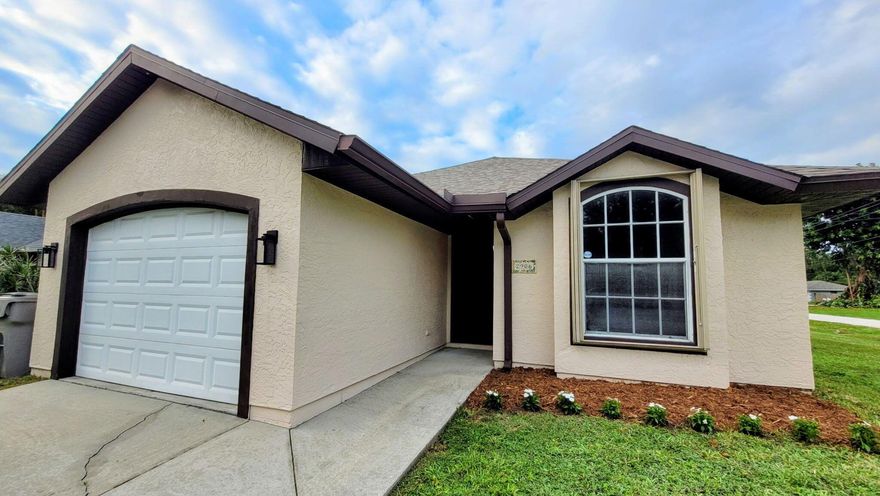 Priced to sell!!  Come see this spacious, open floorplan 3-bedroom, 2 bath home in lovely Vero Beach.  This beauty offers a large living room, dining room, huge cathedral ceilings and screened patio with views of your oversized fully fenced corner lot! Roof from 2018 and full accordion shutters put safety first. Your chef's kitchen equipped with stainless appliances, massive bar with room for 5+ stools and loads of counter space makes cooking a dream!  Kid and pet friendly with newer vinyl flooring, separate laundry room and bathroom updates make this home stand above the rest.  Investor-friendly with no HOA, room for boat or RV parking, so bring the toys. Priced aggressively so hurry!  Buyer may qualify for Hometown Hero Grant of up to 5% with approved lender, inquire within!