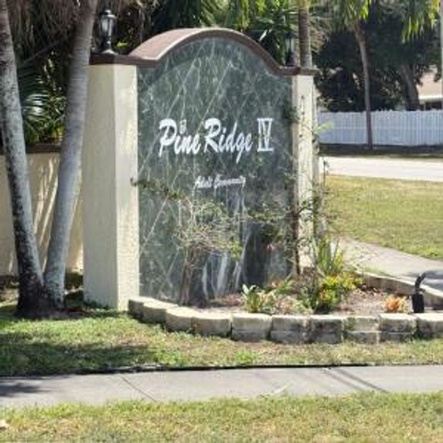 Welcome to Pine Ridge IV -- a well-maintained, active community conveniently located in the heart of Greenacres. This 2-bedroom, 1-bath condo is in original condition, ready for your personal updates and design touches. Features include a newer roof (approx. 2 years old), an open living/dining area, and a spacious primary bedroom with plenty of closet space. Enjoy the peaceful setting with beautifully kept grounds, walking paths, and community amenities including a pool, clubhouse, and tennis. The unit comes with one assigned parking space and plenty of guest parking nearby. Great opportunity for a seasonal home, first-time buyer, or investor looking to renovate to taste!