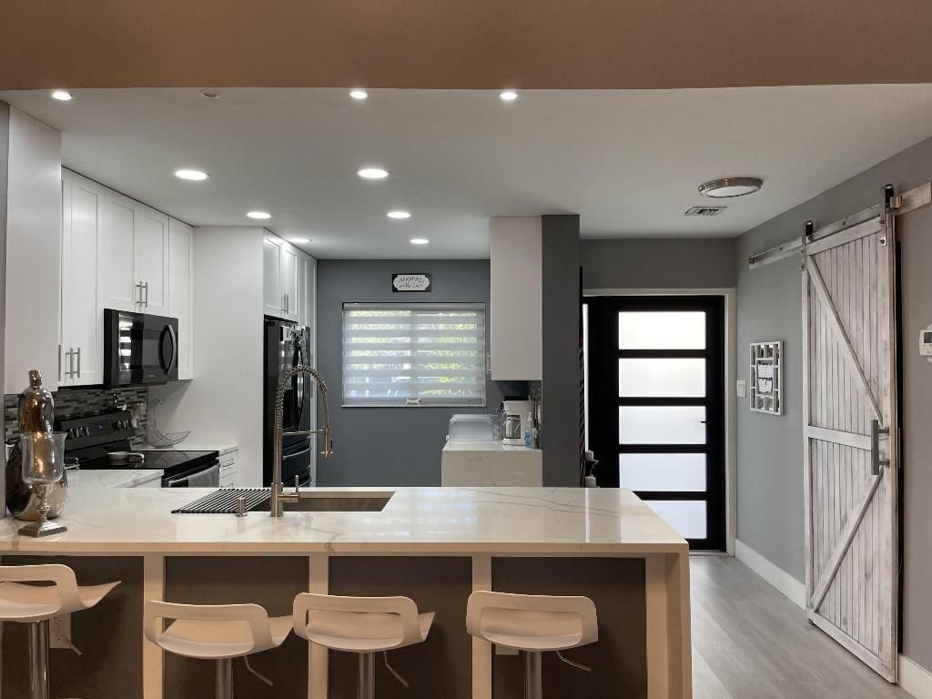 Photo of 1816 Tamarind Lane, Coconut Creek, FL 33063 (MLS # R10978324)