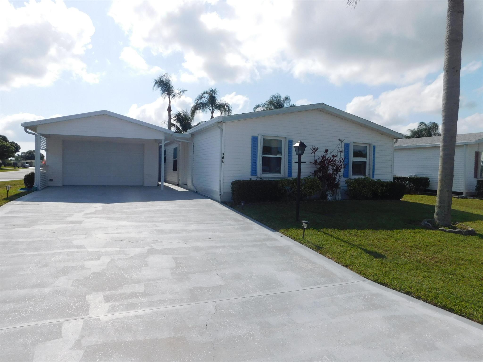 LARGE PRICE REDUCTION! Move in READY HOME! Seller is motivated. This three bedroom, two bath home is ready for you. Granite counter tops, plenty of cabinets, tile flooring in the kitchen. Plus, a breakfast nook. King size master with an attached bath. Entertainment size living room. A one-of-a-kind super-size lanai with windows, screens, a/c and lake view. It is the place for a BIG SCREEN TV. Two more good size bedrooms and second full bath. One could be an office or a craft room. Spacious one car garage with cabinets and shelving, is a bonus. Large corner lot in fabulous Savanna Club, an active 55+ community. This home deserves a look.Land lease property. Home is VACANT.