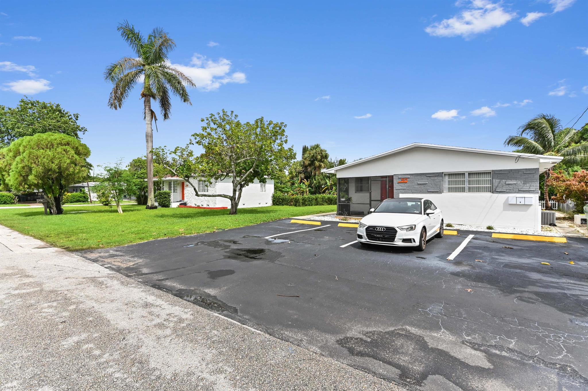 Beautifully remodeled Four-plex in the heart of Hallandale Beach. Fully Rented. CASH COW! Single-family home 2/1 with a private yard and 2-car parking, detached from the separate structure of two 1-bedroom, 1-bath units, and a 1-bedroom with 2 bathrooms. HUGE 19,698 SQFT LOT with fruit trees. New central A/C units and a freshly re-paved parking area. Just minutes from Aventura Mall, shopping centers and the beaches.