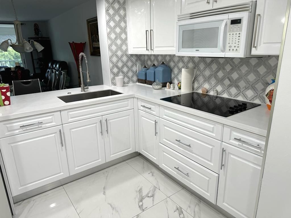 Photo of 7640 NW 18th St #405, Margate, FL 33063 (MLS # F10383210)