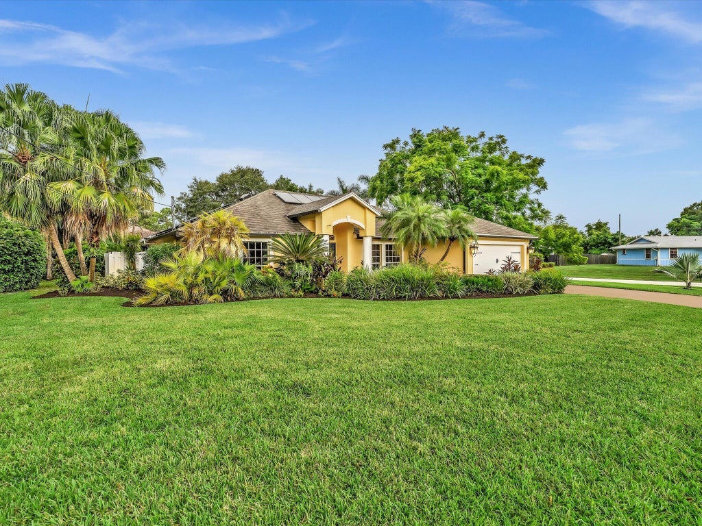 Photo of 1918 SW BELLEVUE Avenue, Port Saint Lucie, FL 34953 (MLS # B26083329)