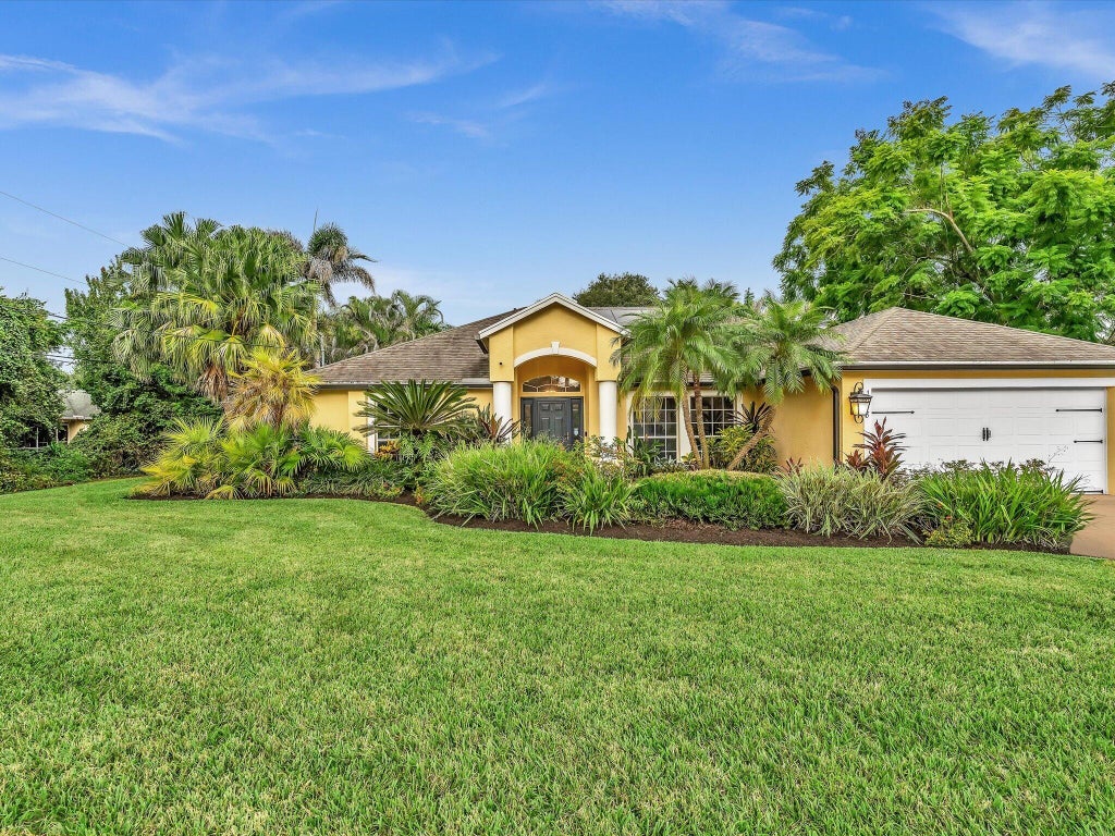 Photo of 1918 SW BELLEVUE Avenue, Port Saint Lucie, FL 34953 (MLS # B26083329)