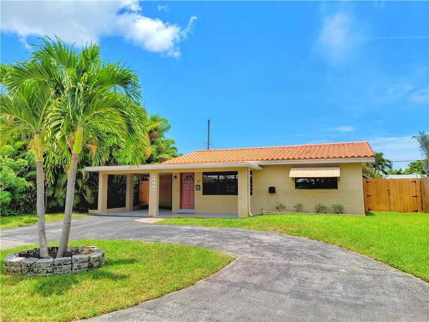 Welcome home to this spectacular 2 bedroom 2 bath house with den that can be used as a 3 bedroom home in desirable North Andrews Gardens.  This hidden gem has an updated kitchen with granite countertops and SS appliances.  Wood laminate flooring throughout (kitchen has ceramic tile) and an efficient laundry room with Maytag washer and dryer.  A/C installed in 2020 and updated electrical panel.  Covered patio and spacious backyard with room for a pool makes this an entertainer's oasis.  New wood fence recently installed.  Close to restaurants, beaches, shops, Wilton Manors, funky buddha brewery, airport and I-95.  Excellent location so bring your flair for decorating and design and put your personal stamp on this stunning property.  Ring doorbell does not convey. 2 bed 2 bath  house in desirable North Andrews Gardens (NAR). Property has updated kitchen with granite countertops and SS appliances.  A/C 2020, updated electrical panel and new pavers in back yard.  New wood fence coming soon.  Room for a pool.