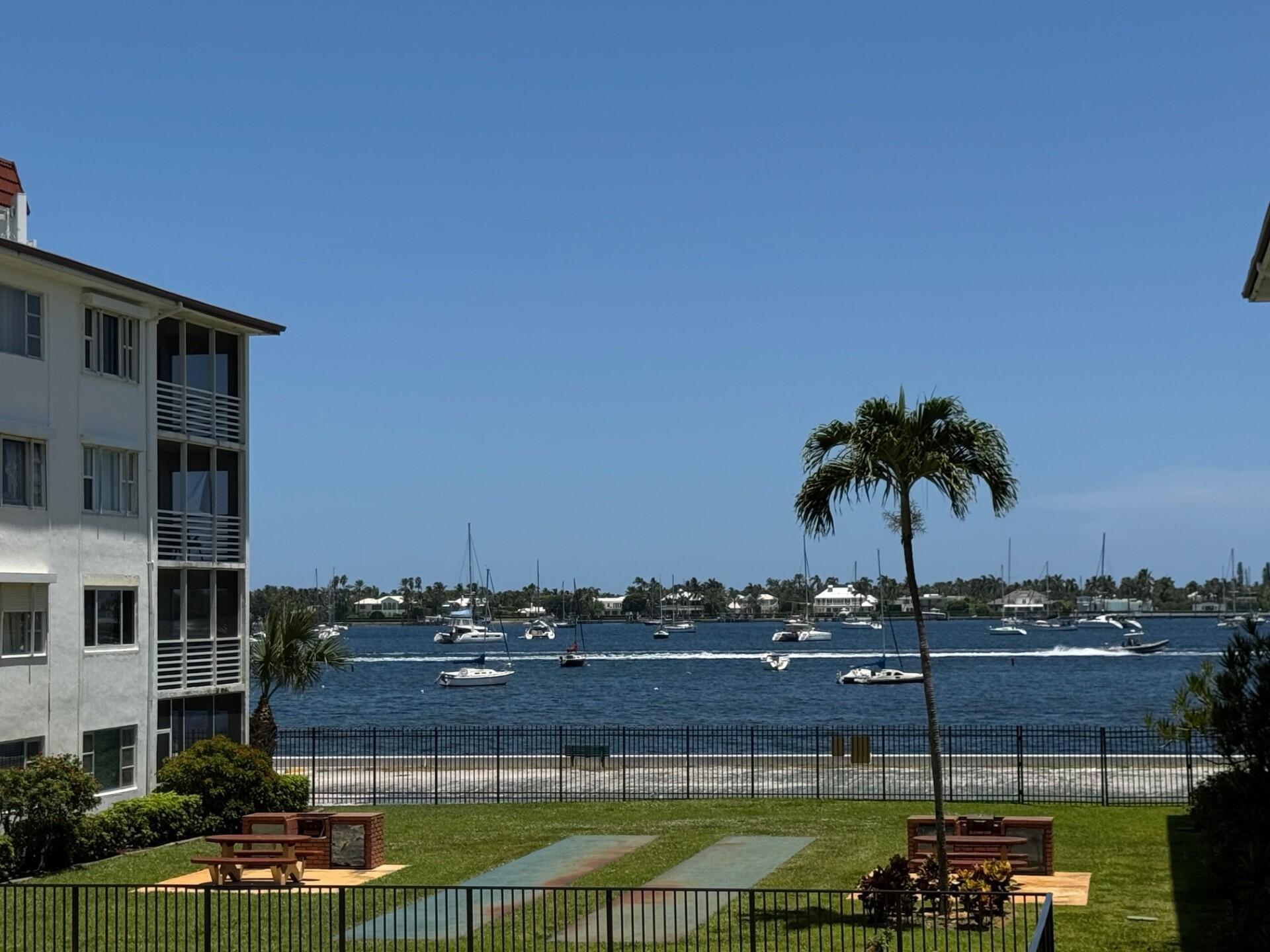 PARADISE WATERFRONT LIVING GATED COMMUNITY ON NORTH FLAGLER WATERFRONT. 2 BEDROOM 1.5 BATHROOMS,WOOD FLOORS, SCREENED PATIO. WATERVIEWS FRONT BALCONY, CLEAN KITCHEN WITH UPDATED APPLIANCES, TROPICAL POOL AREA, BBQ'S 1 ASSIGNED PARKING SPOT, COMPLEX IS STEPS TO NORTHWOOD ROAD, MINUTES TO DOWNTOWN, CLEMATIS, PALM BEACH AND SINGER ISLAND, AIRPORT. TRULY WORLD CLASS WATERFRONT LIVING. PARADISE FOUND!!!