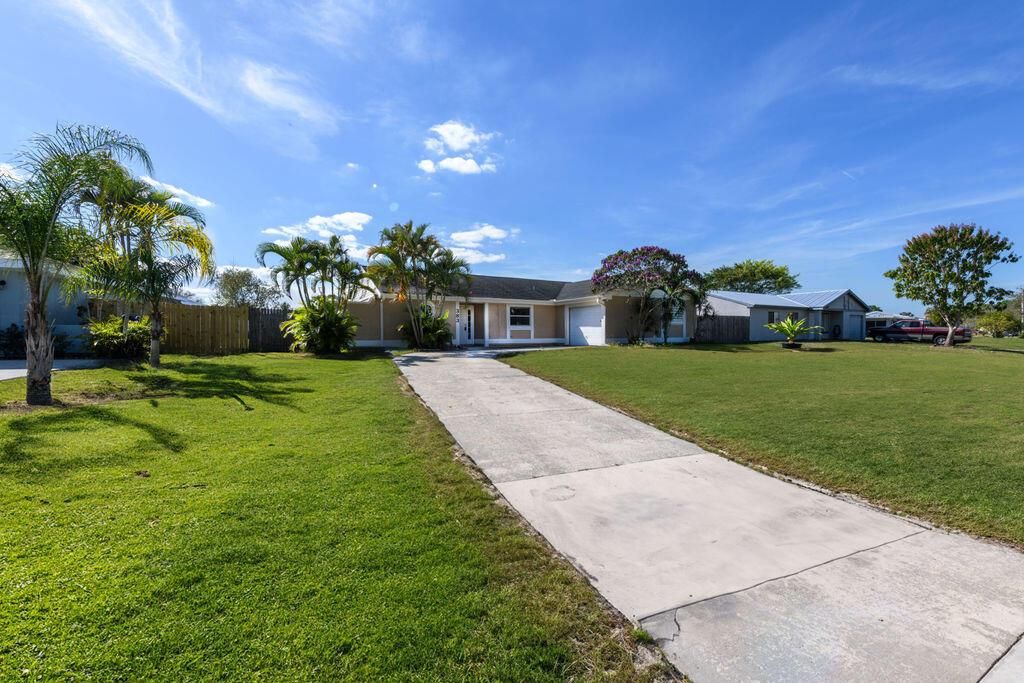 Photo of 383 SW Tulip Boulevard, Port Saint Lucie, FL 34953 (MLS # R10964615)