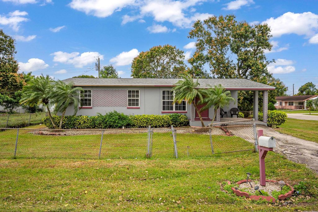 Photo of 932 SW Avenue G Place, Belle Glade, FL 33430 (MLS # R11057666)