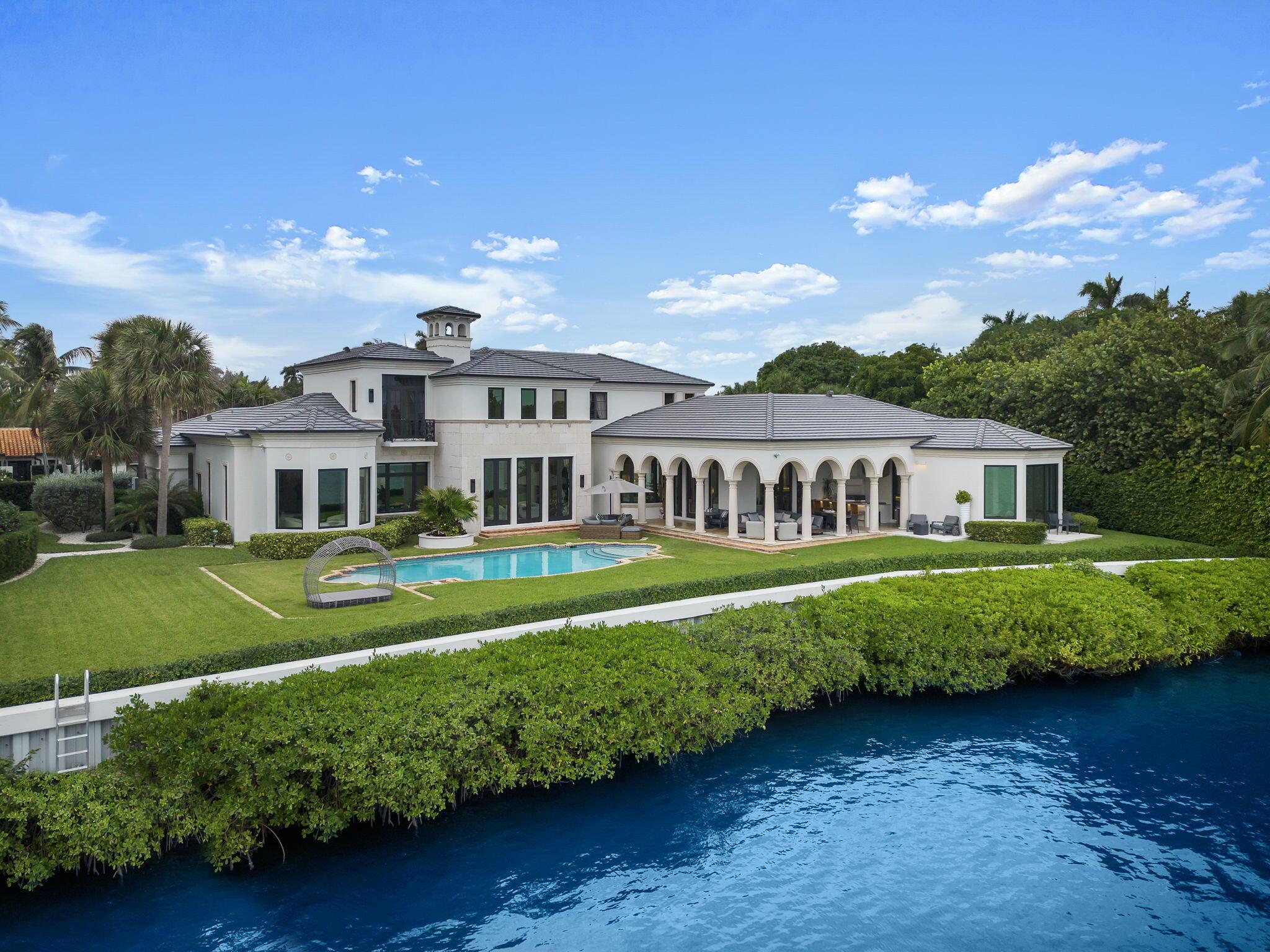 Welcome to this stunning 10,645 total square foot home that was completely renovated in 2023. Located on an over half acre, high elevation, waterfront lot in the prestigious Manalapan, Florida. This luxurious property features a brand new roof, impact doors and windows, multi-zoned air conditioning system, tankless water heater, full house generator, custom cabinetry and closets, top of the line finishes and so much more! As you step inside, you will immediately be captivated by the grandeur of this residence. With 6 bedrooms, 8 full baths, and 2 half baths, this home is designed with ample space and comfort. The first floor features a primary suite with his and her en suite bathrooms, oversized walk-in closets, home office and sitting room overlooking the water.
