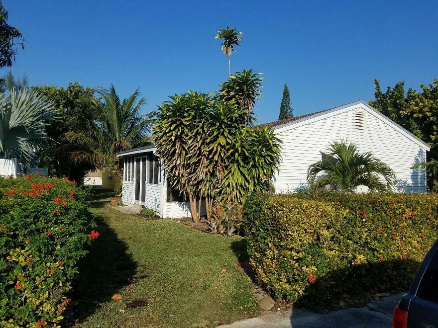 FANTASTIC opportunity to buy, rent, live, work! This Triplex, strategically positioned within close proximity to the booming historic town of downtown Lake Worth allows you to utilize its space in a multitude of ways. Air B N B with no restrictions, less than 2 miles to golden beaches and our fantastic new Board Walk, Iconic Benny's on the Beach now open to watch the sunset and all the water sports you can imagine, happening in paradise!  Collect rent in 2 units while you vacation for free in your third unit! Live one, rent one, work in one! What better office can you have?! Your imagination is the only limit to what this property offers. The main house consisting of 1 bedroom 1 bath on each side has been fully renovated, while the private back unit also a 1 bedroom 1 bath has been updated