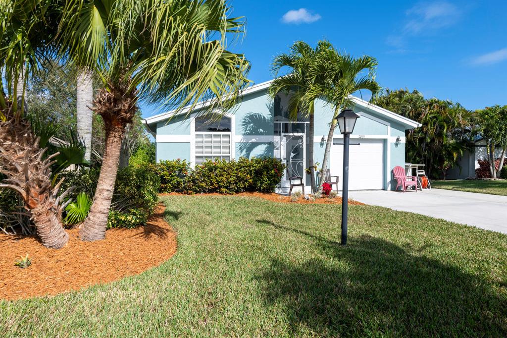 Exquisite 2/2/1 with Den home in St Lucie Falls 55+ community. This home has been immaculately maintained. Outside painted Dec 2020. Open concept with cathedral ceilings. No carpet. Tile floor throughout. Roof replaced in 2017, HVAC new in 2018 and hot water heater in 2015. Screened in entrance and patio. St. Lucie Falls has two club houses, two pools, gym, library, billiards, tennis, shuffleboard and bocce ball courts. Community also has unlimited access to a boat ramp. Boats, campers, RVs, Jet skis can all be stored at the storage facility for a minimal fee.