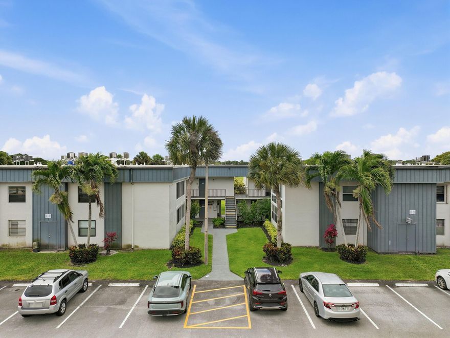 Move right into this beautifully remodeled, partially furnished condo in the Piedmont Section of Kings Point. This 2nd-floor unit, conveniently located near the elevator, features tile flooring throughout and a fully updated kitchen with new cabinetry, countertops, backsplash, and stainless-steel appliances. Both bathrooms have been tastefully renovated with walk-in showers, modern fixtures, cabinetry, tile, and grab bars. The kitchen opens to an oversized enclosed patio overlooking the entranceway, complete with a portable A/C unit for added comfort. Enjoy resort-style living in this vibrant 55+ community offering multiple clubhouses, pools, golf, tennis, pickleball, fitness centers, a 1,250-seat theater, cafes, clubs, activities, and courtesy shuttles. Easy access to I-95 and Turnpike.