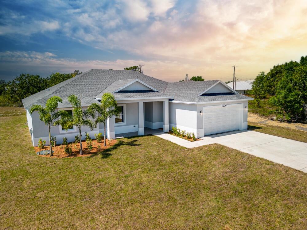 Photo of 544 SW Carter Avenue, Port Saint Lucie, FL 34953 (MLS # R10897416)