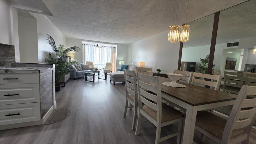 Completely updated, spacious 1-bedroom, 1-bath corner unit on the first floor. This bright condo features an open, modern kitchen with white cabinetry, stainless steel appliances, tile backsplash, porcelain countertops, and a large pantry for extra storage.

The updated bathroom, tile and waterproof flooring throughout, new lighting, and ceiling fans add to the move-in-ready appeal. Fully furnished with brand-new modern furniture (2023). Water heater (2019) and A/C (2019).

Enjoy abundant natural light and a Florida room with impact windows overlooking relaxing garden views. Ideally located next to the pool, amenities, and clubhouse in Building B. Well-managed and well-maintained building within Somerset Phase 2, an active 55+ gated community offering numerous activities and amenities.