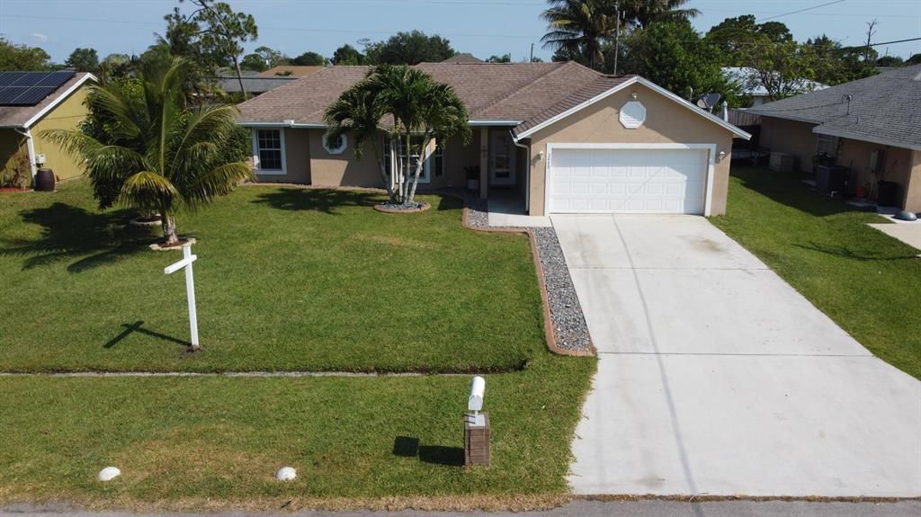 Photo of 2480 SW Falcon Circle, Port Saint Lucie, FL 34953 (MLS # R10801660)