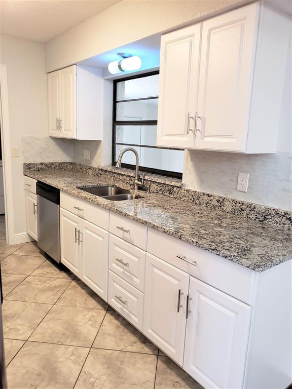 Beautifully renovated 4 bedroom, 2 bath home with garage and Family room + a large bonus room and separate spacious inside laundry room. This lovely home on a quiet street has a fenced yard and extra wide and long driveway. The lawn maintenance is included in the rent. Newer HVAC system. Beautiful wood and tile floors, granite countertops, SS appliances in the kitchen. Washer and Dryer. Desirable 2/2 split floorplan. with open Living Rm and Dining Rm areas. The bonus room is privately located in back making an ideal den or space for working at home. Great neighborhood. No HOA so just landlord approval. Available now. Pets on a case by case basis. No smoking.