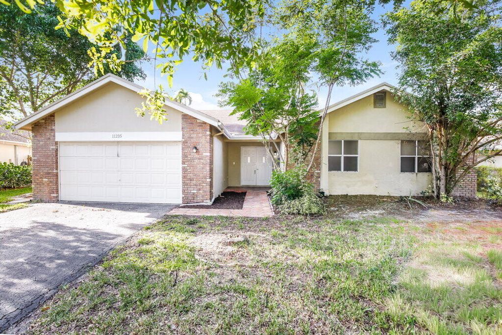 Photo of 11235 NW 43rd Place, Coral Springs, FL 33065 (MLS # B26044432)