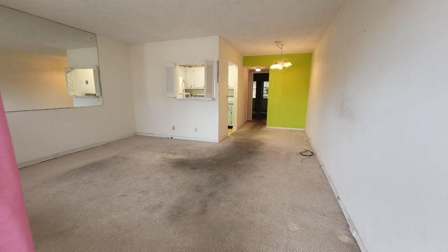 Bring offers, motivated seller.  Ground floor, one bedroom, one bathroom unit ready for your updates and personalization.  Newer air conditioning units in both living room and bedroom.  Newer appliances in kitchen.  Large pantry/closet adjacent to kitchen. Lanai features awning type rollout windows and screens.  New roof to be installed in Oct or Nov 2025 and fully funded.  No special assessments!  Laundry rooms on both 1st and 2nd floor.  This is a non-smoking building.  Rentable and pet friendly.