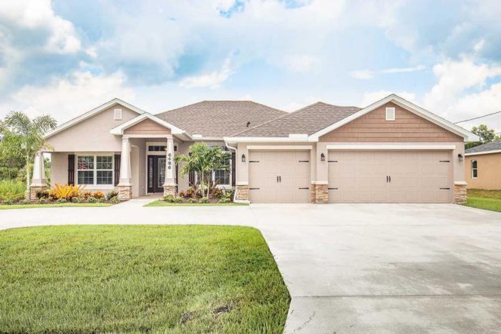 Photo of 5302 NW North Macedo Boulevard, Port Saint Lucie, FL 34983 (MLS # R10779374)
