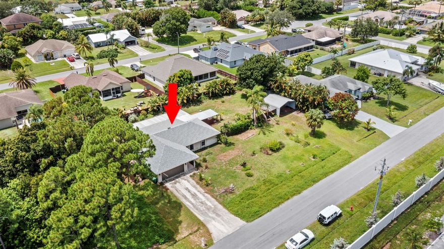 Sitting on nearly half an acre (0.46 acres) in a prime location just off Gatlin, this 3-bedroom, 2-bath home offers incredible outdoor living and unbeatable convenience. Enjoy a spacious backyard with RV parking, a storage shed, a deck with an outdoor kitchen, and a relaxing jacuzzi, perfect for entertaining or quiet evenings at home. Inside, you'll find a great layout and a brand-new roof for peace of mind. The popcorn ceilings have already been removed, and while the current all-black paint creates a dramatic look, it's an easy update for your own style. Giving you the opportunity to make this home truly yours without major renovations.With a double lot, spacious yard, and a family-friendly neighborhood, this property blends privacy, location, and potential in one unique package.