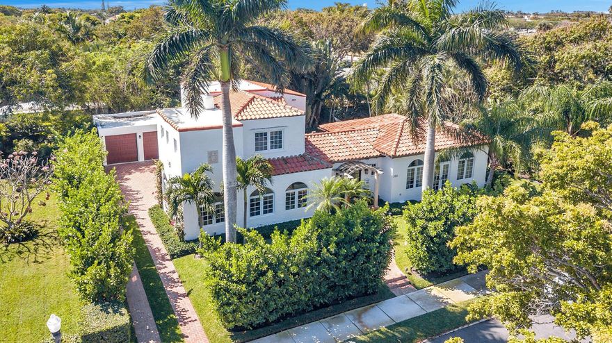 The best of everything can be found in this treasure of a home. It is East of Olive in the South End of West Palm Beach on a thru street to the intercoastal. It has over a 10.000 sqft. lot, 4 total bedrooms including a 1/1 guest house, two car garage, salt water pool with heater, large office, mature and lush landscaping. This home features an array of Indoor and outdoor, formal and family style entertaining spaces. Tons of natural light and rich architectural detail can be found throughout the residence.