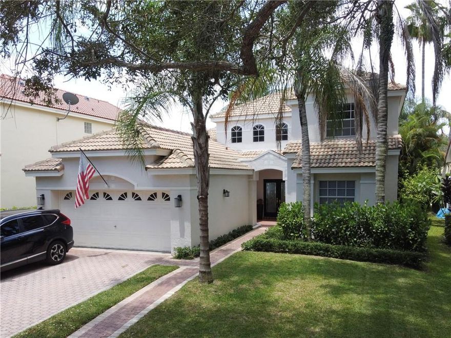 Stately 2-story lakefront home located in the Hibiscus Island neighborhood of Weston. Home features 3 Bedrooms, 2.5 Bathrooms + Den space (playroom or home office) and tall ceilings filled with natural lighting. Enjoy sunsets over the long lake views from the screened enclosure under the shade of mature coconut trees. Hibiscus Island is a gated community near Weston Town Center that features a community pool, playground, basketball court and shady tree lined streets. Well located to A rated schools Indian Trace Elementary (biking distance), Tequesta Trace Middle (walking distance) and Cypress Bay High School. Available 8/1/22, home is being rented furnished or unfurnished.