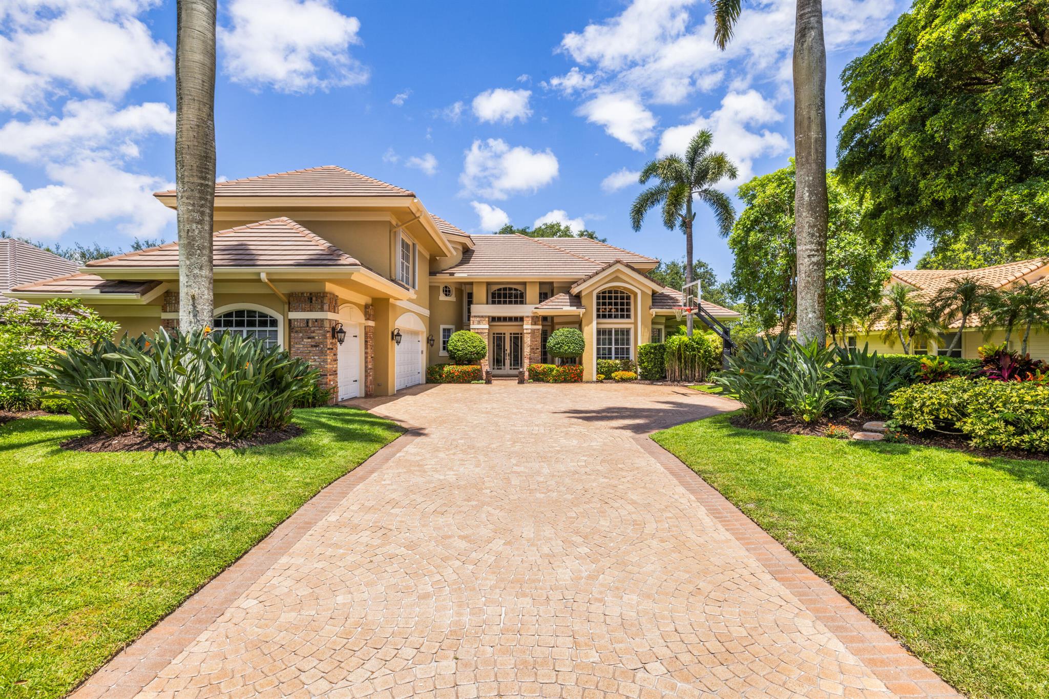 Located on the 16th hole of The Match Course at PGA National, this CBS masterpiece provides architectural brilliance with serene fairway views! The 4-bed, 4.5-bath home welcomes you with soaring ceilings, French doors, hardwood floors, & rich millwork throughout. The kitchen's central island anchors the culinary hub, surrounded by bespoke cabinetry & luminous granite countertops. Your primary suite features marble floors & a private balcony with breathtaking lake vistas, plus a luxurious ensuite. The first level study displays a custom oak entertainment center. The second level media room offers flexibility as a 5th bedroom. The fenced backyard is a sun-drenched retreat with a pool & paver patio. Enjoy amenities only PGA National can offer--championship golf at The Match, tennis, & more!